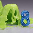 a blue and green object sitting on top of a table